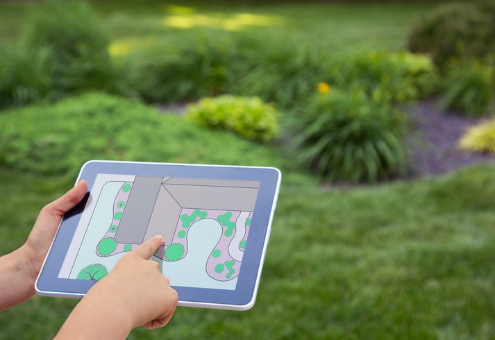 Lee's Nursery and Landscaping | Rock Hill, SC | looking at landscape plan on digital tablet