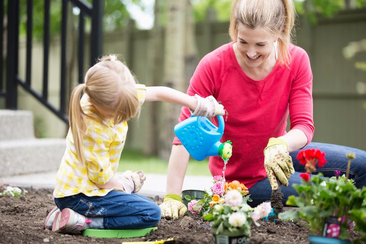Lee's Nursery and Landscaping | Rock Hill, SC | mother and daughter planting flowers in yard